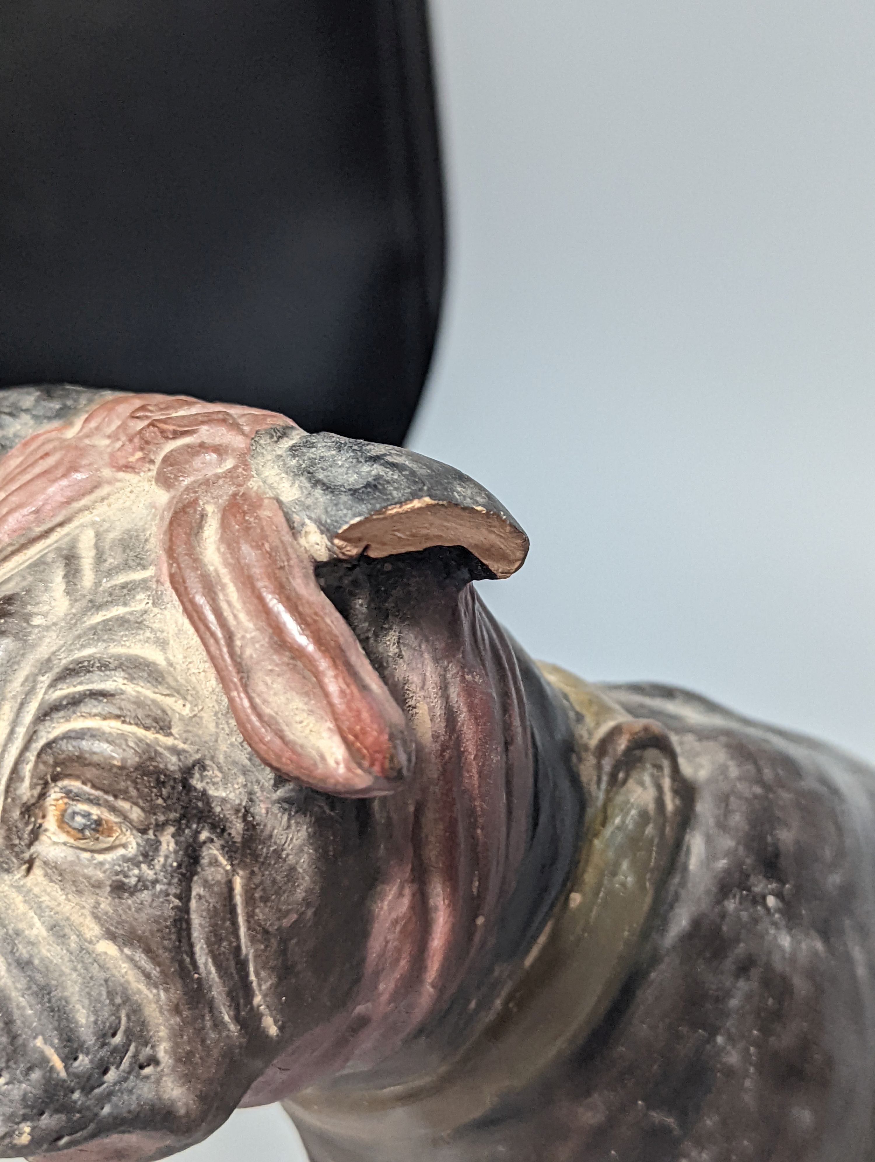 An Austrian cold painted terracotta model of a dog wearing a bandana, 21.5cm high